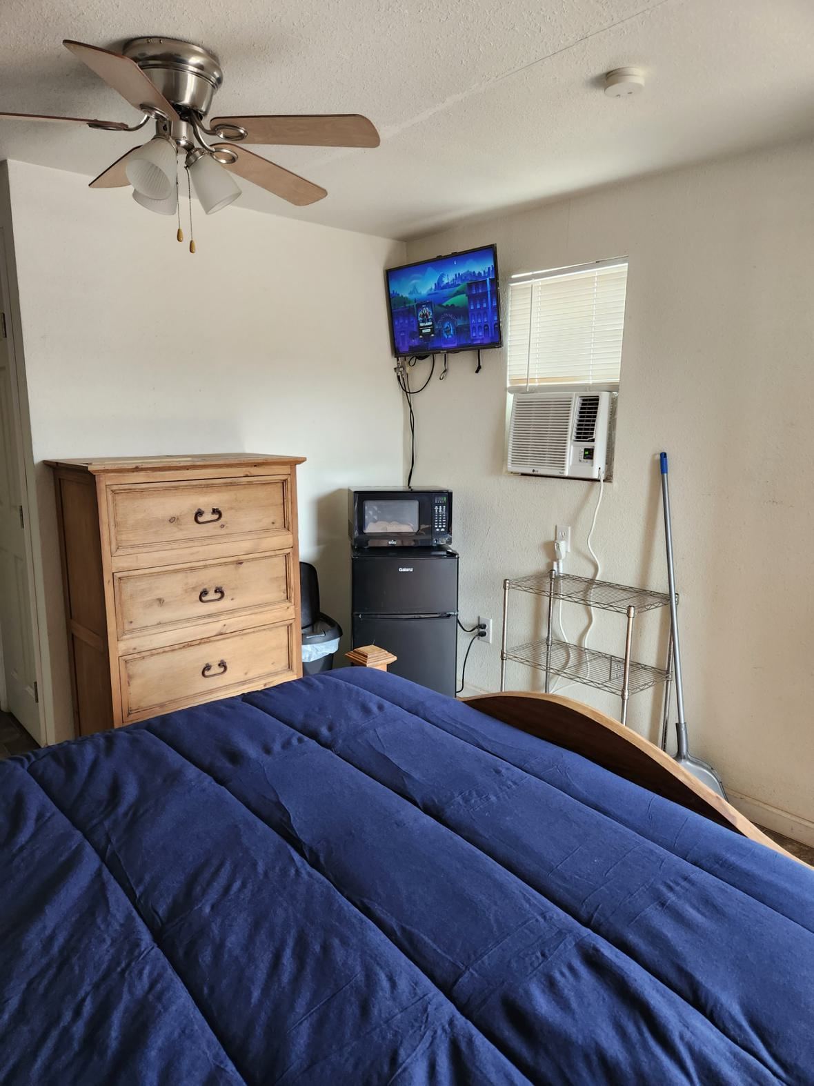 Dresser, TV, fridge and microwave