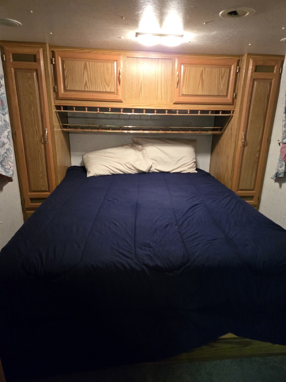 Bedroom with storage overhead