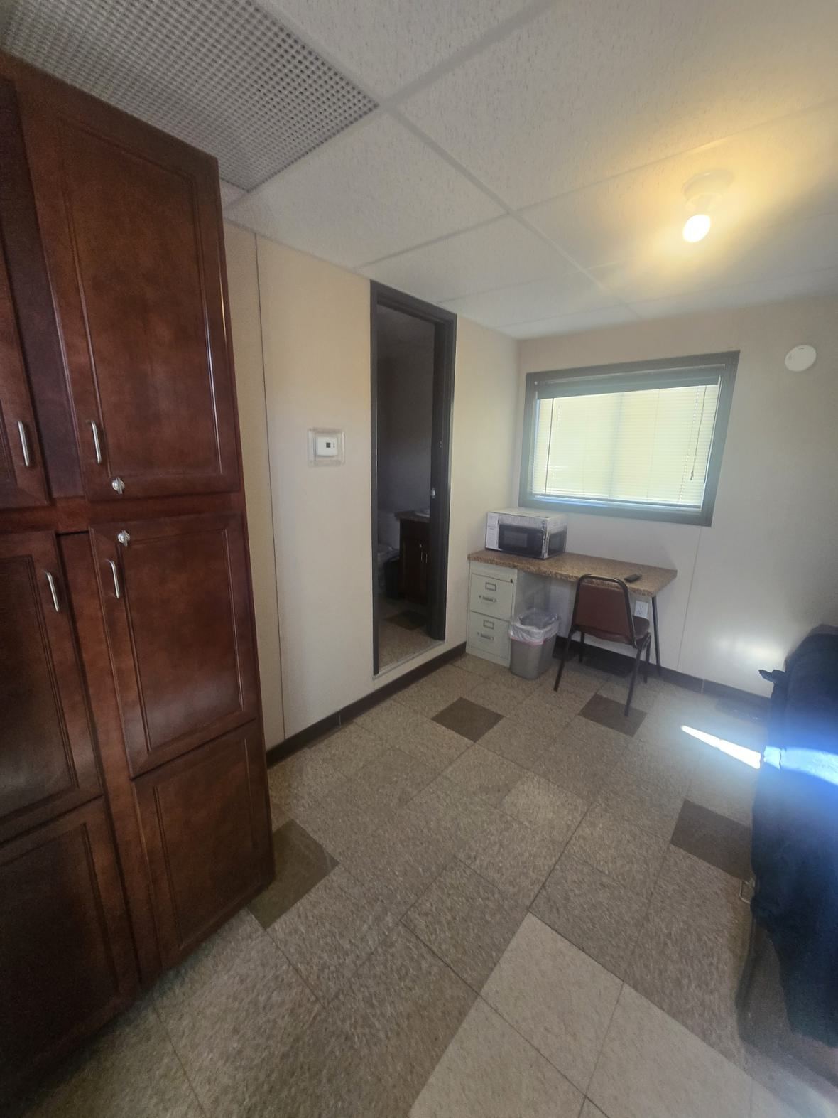 Looking in from the door — wardrobe on the left