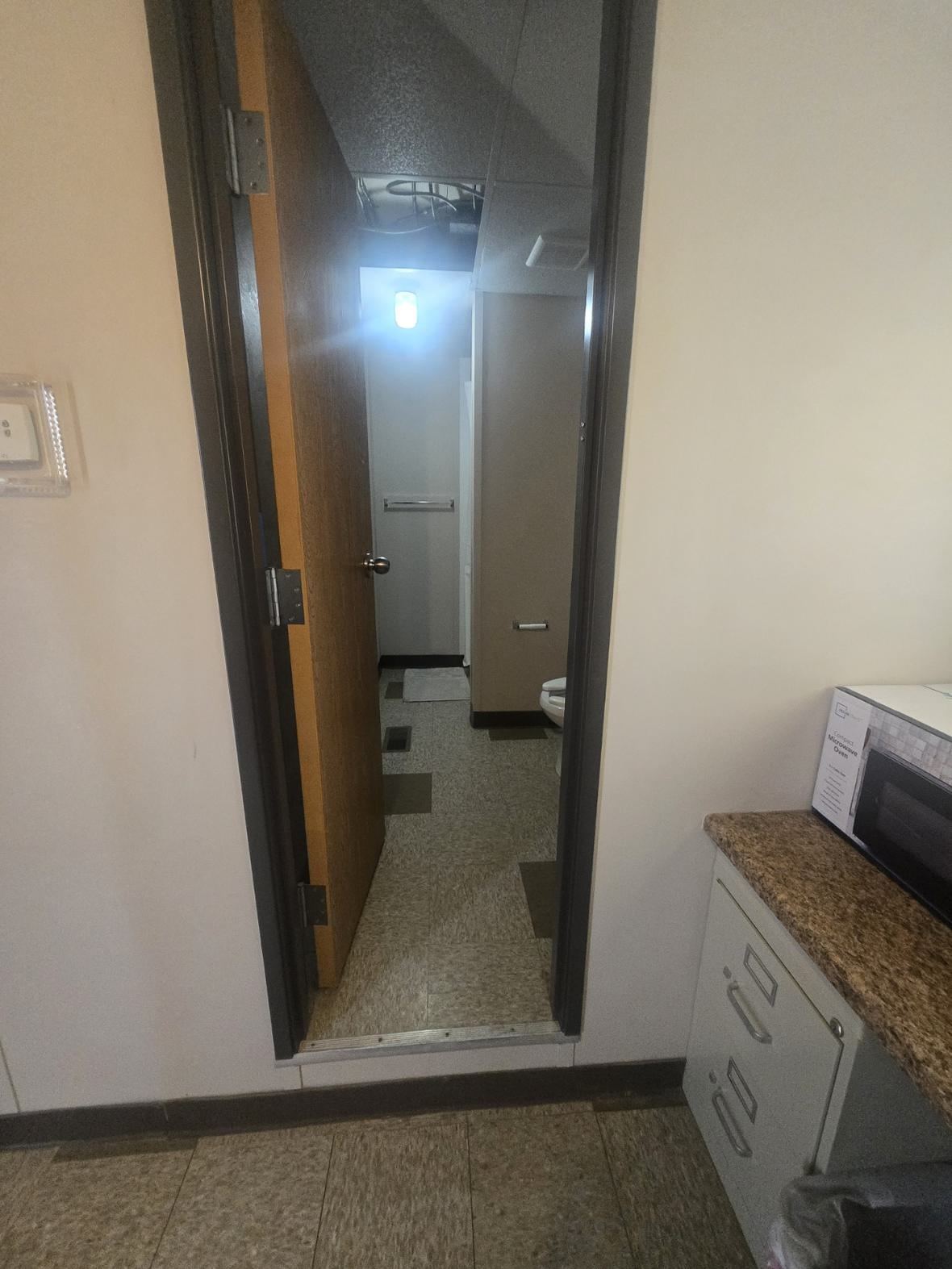 Microwave on the counter, and the door to your own bathroom